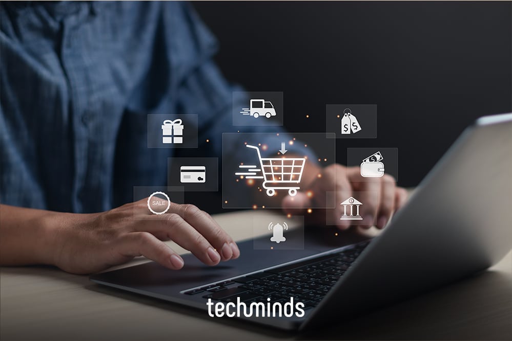 Person am Laptop mit Warenkorb- und Shopping-Icons, Jobprofil E-Commerce Manager